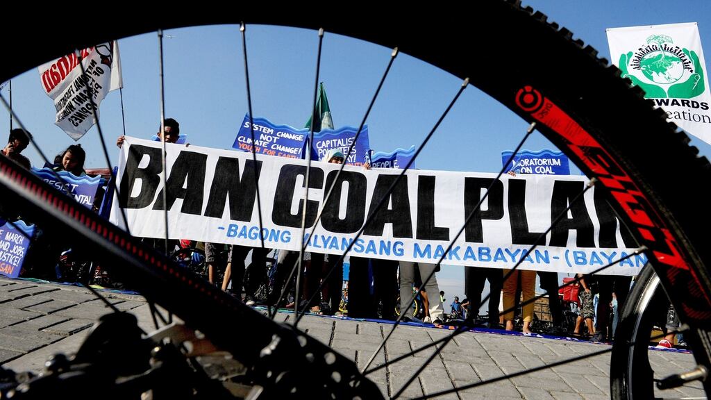 Environmentalists urging a ban on coal-burning plants take part in a bicycle ride to show solidarity for the global movement for climate justice in Manila, the Philippines on Sunday, December 13th, 2015. Photograph: Jay Directo/AFP/Getty Images