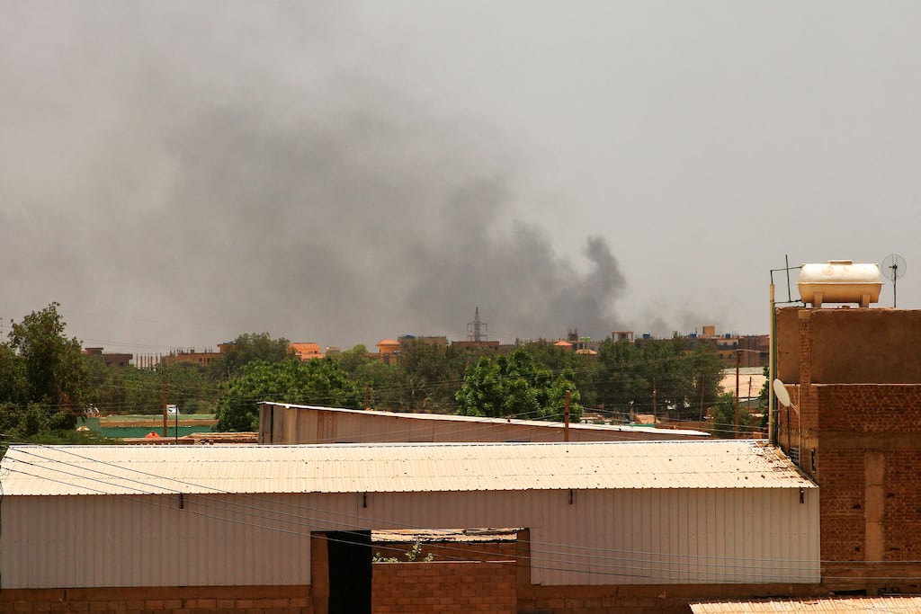 Smoke billows over the Sudanese capital Khartoum as fighting between two rival generals persists.. Photograph: AFP