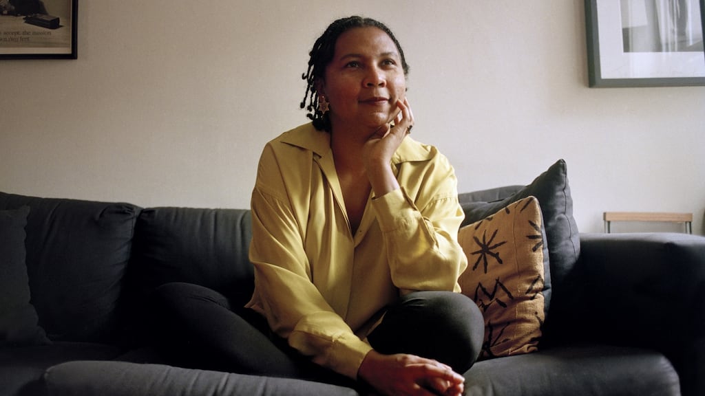 The author bell hooks at her apartment in Manhattan in 1995. hooks died on Wednesday, December 15th, at her home in Berea, Kentucky. She was 69. Photograph: Monica Almeida/ The New York Times