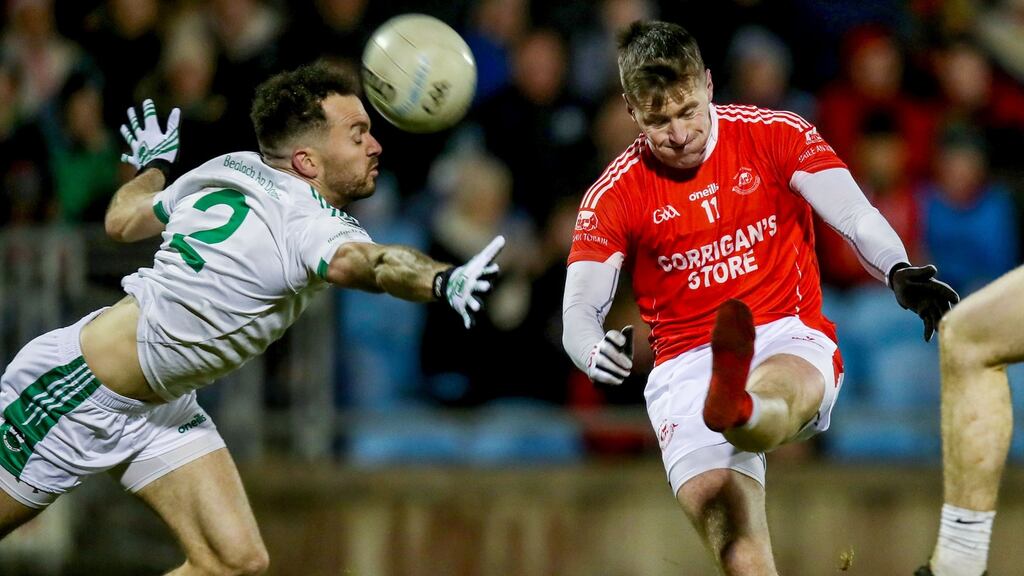 Cillian O’Connor of Ballintubber gets his shot away despite the attempt  to block by Ballaghaderreen’s David Drake during the Mayo SFC Final at  Elvery’s MacHale Park in  Castlebar. Photograph: Bryan Keane/Inpho