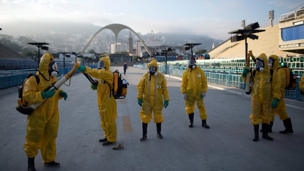 Health workers under the bleachers of the Sambadrome in Rio de Janeiro in January get ready to spray insecticide to combat the Aedes aegypti mosquitoes that transmit the Zika virus. Photograph:Leo Correa/AP