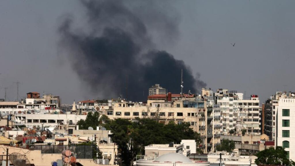Columns of smoke rise from heavy shelling in the Jobar neighbourhood, east of Damascus, yesterday. Syria reached an agreement with the United Nations yesterday to allow a team of experts to visit the site of alleged chemical weapons attacks last week outside Damascus. Photograph: Hassan Ammar/AP