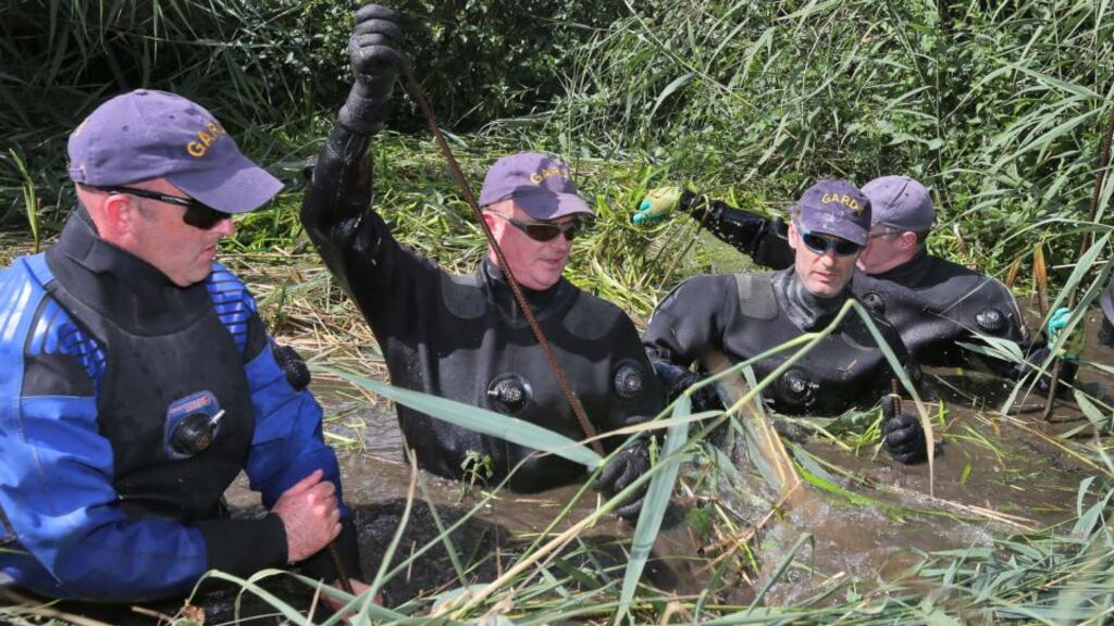 Members of the Garda Water Unit search through swamp land  during a new search for Ciara Breen, who disappeared in 1997. Photograph: Colin Keegan/Collins Dublin