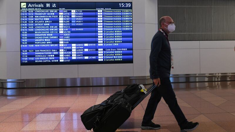 A traveler at Haneda Airport in Tokyo, Japan. Photograph: Noriko Hayashi/Bloomberg