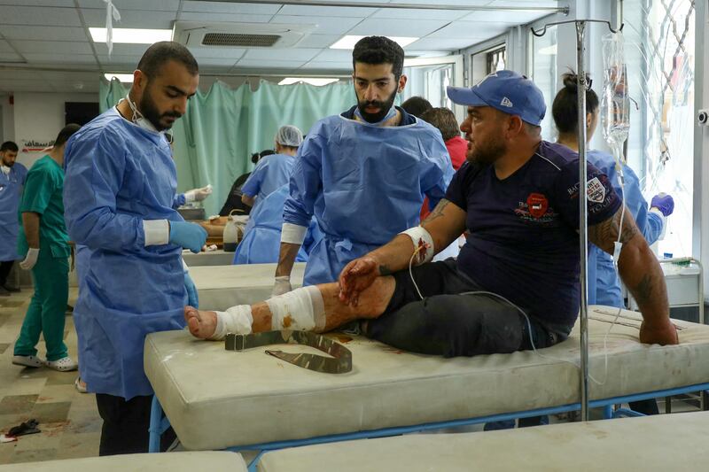 A wounded man receives treatment at a hospital in Syria's southern city of Sweida on Friday. Photograph: Shadi Al-Dubaisi/AFP