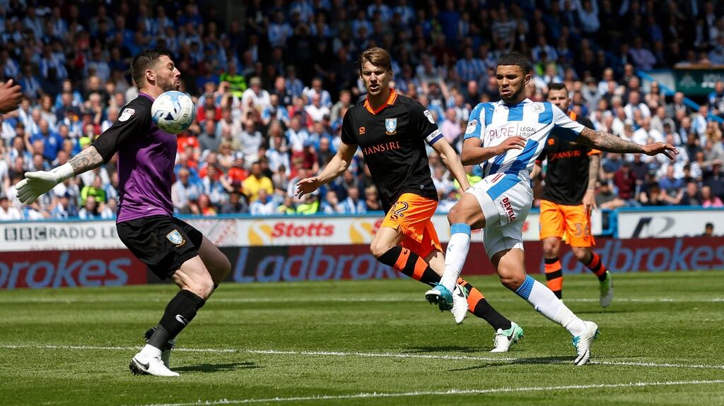 Ireland goalkeeper Kieren Westwood saves a shot from Nahki Wells during Sheffield Wednesday’s play-off draw with Huddersfield Town. Photograph: Reuters/Ed Sykes