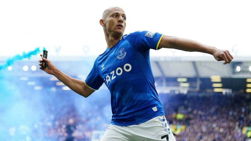 Everton’s Richarlison tosses a flare as he celebrates scoring against Chelsea at Goodison Park,  Liverpool. Photograph: Jon Super/AP Photo
