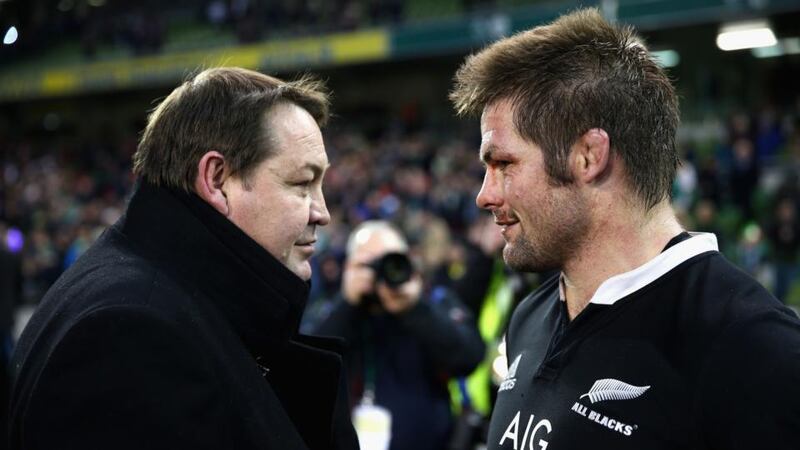 All Black coach Steve Hansen (left) talks with captain Richie McCaw after their 14th win of the year in Dublin last month. Hansen was named coach of the year by the IRB. Photograph: Phil Walter/Getty Images