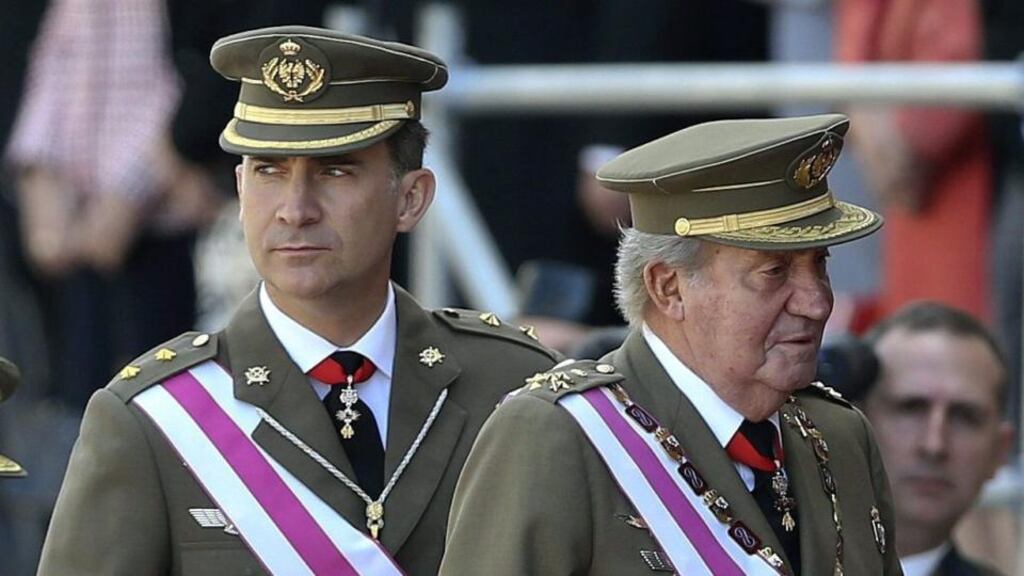 King Juan Carlos of Spain and his son Felipe arrive for a military ceremony of the San Hermenegildo order held at the monastery of San Lorenzo de El Escorial on the outskirts of Madrid yesterday. Photograph: EPA/Ballesteros
