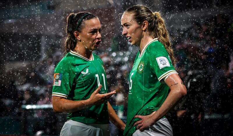 Ireland’s Katie McCabe speaks with Megan Connolly. Photograph: Ryan Byrne/Inpho