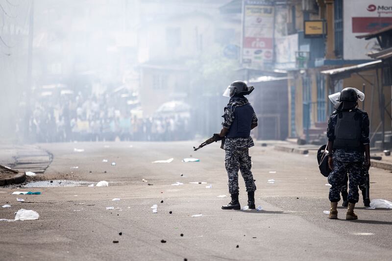 Police officers disperse supporters of the All People's Congress during a protest in Freetown on Wednesday over alleged electoral fraud ahead of the Sierra Leone general elections. Photograph: John Wessel/AFP