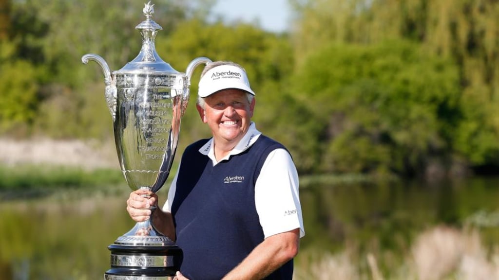 Colin Montgomerie of Scotland poses with the Alfred S Bourne Trophy after winning the 2014 Senior PGA Championship in Benton Harbor, Michigan. Photograph: Gregory Shamus/Getty Images