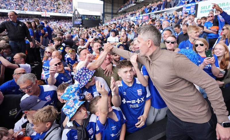Kieran McKenna celebrates with fans following Ipswich Town's promotion to the Premier League after the victory over Huddersfield Town at Portman Road. Photograph: Zac Goodwin/PA