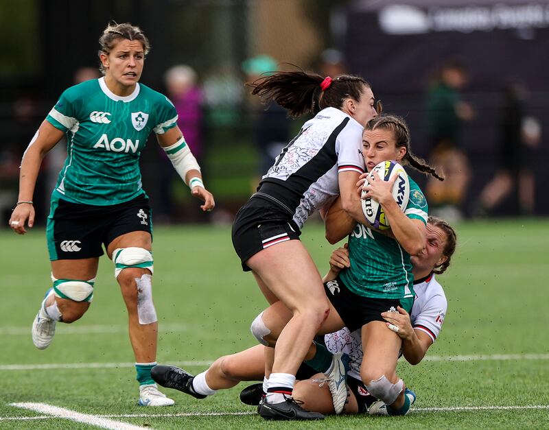 Ireland's Emily Lane is tackled during the WXV 1 game against Canada in Langley, Canada. Photograph: Travis Prior/Inpho
