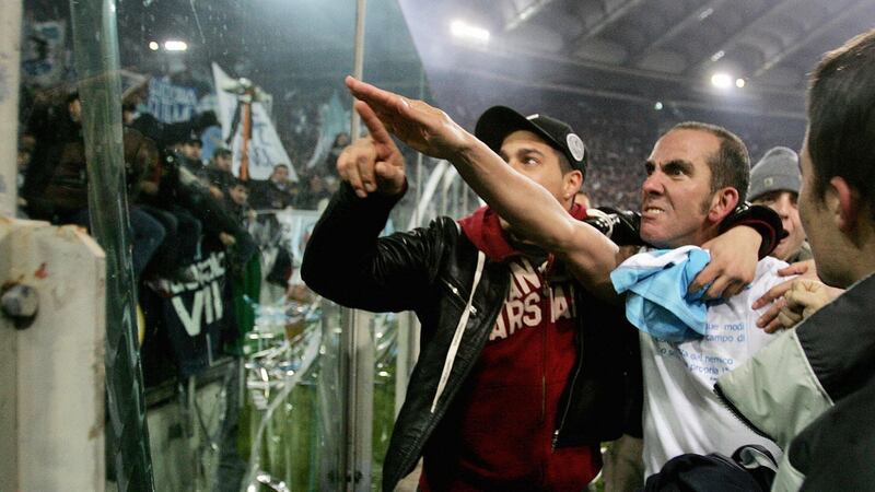 Paolo Di Canio raises a right arm salute to Lazio fans after a game against Roma in 2005. Photo: Paolo Cocco/Getty Images