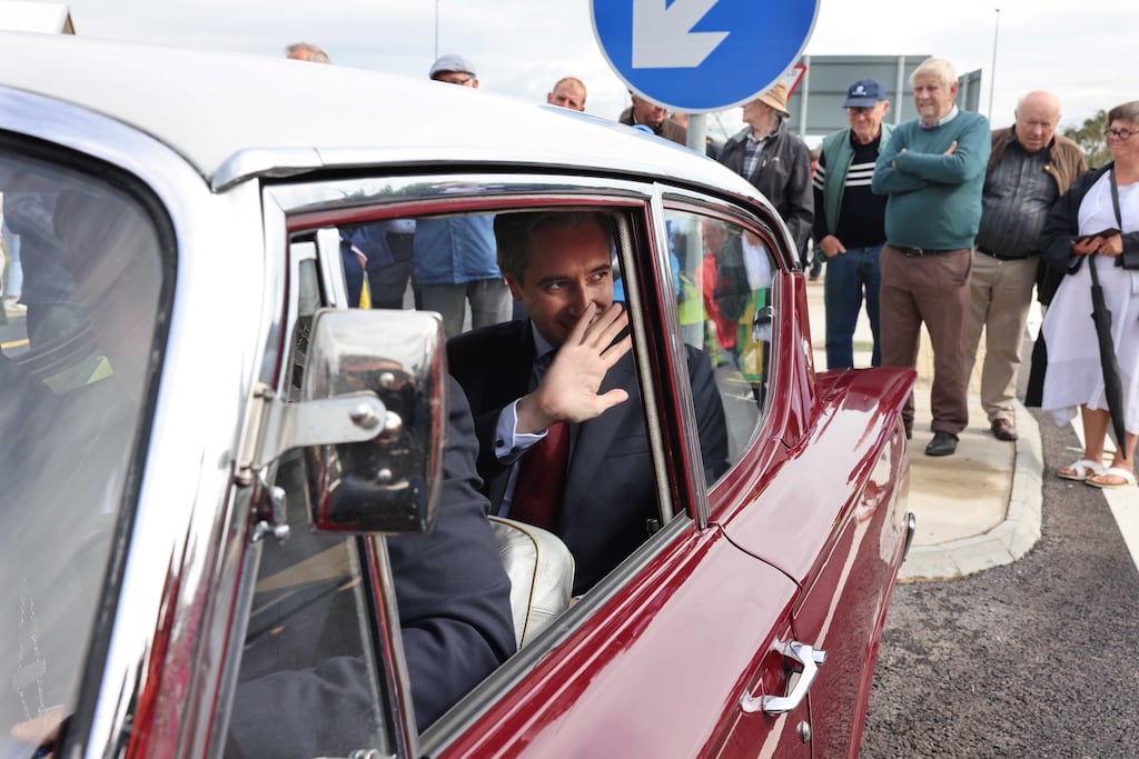 Taoiseach Simon Harris at the official opening the Listowel Bypass in a 1962 Ford Consul Classic. He has floated the idea of creating a department of infrastructure. Photograph: Dara Mac Dónaill