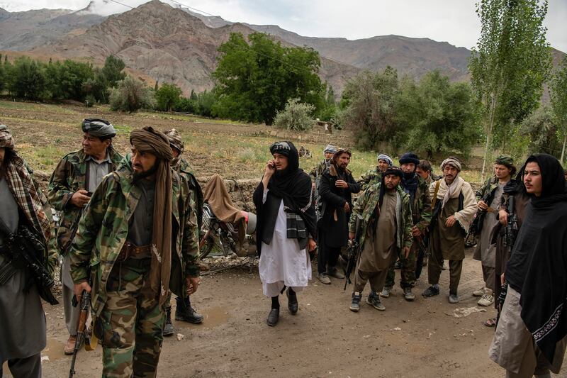 Mawlawi Mahdi Mujahid (centre in white) in Balkh Aab, Afghanistan, on June 21st. Photograph: Kiana Hayeri/New York Times
