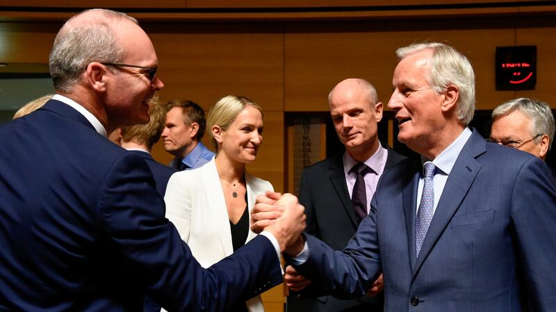 Tánaiste Simon Coveney shakes hands with the European Union’s chief Brexit negotiator Michel Barnier in Luxembourg. Photograph: John Thys/AFP via Getty Images