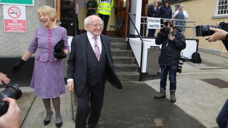 President Michael D Higgins and his wife, Sabina, leave St Mary’s hospital in Phoenix Park after casting their votes in the presidential election and the blasphemy referendum. Photograph: Collins