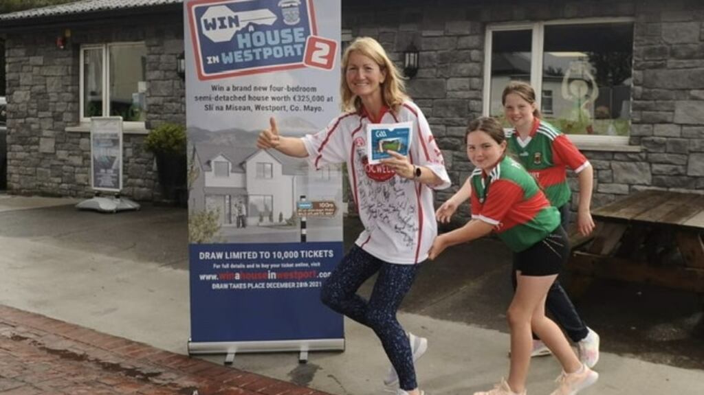 Tyrone supporter Emer Farrell with two of her daughters in Westport, Co Mayo. Photograph: Westport GAA