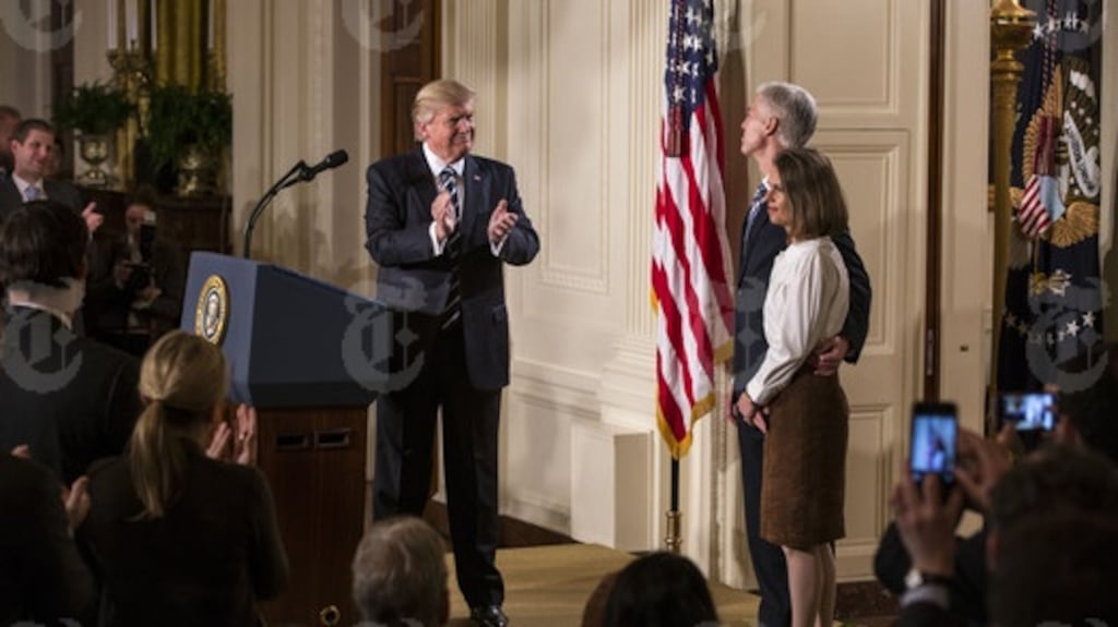 President Donald Trump introduces Judge Neil Gorsuch as his nominee for the vacant Supreme Court seat, at the White House in Washington, Jan. 31, 2017. Gorsuch was appointed to the United States Court of Appeals for the Tenth Circuit by George W. Bush. His wife, Louise Gorsuch, is at right. (Al Drago/The New York Times)