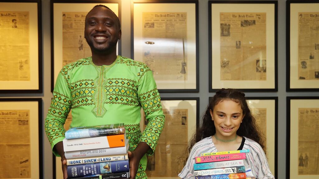 Irish Times Africa Day writing competition winners Oluwasegun Seriki and Lara El-Kadi receive their prizes at The Irish Times today. Photograph: Lorraine O’Sullivan