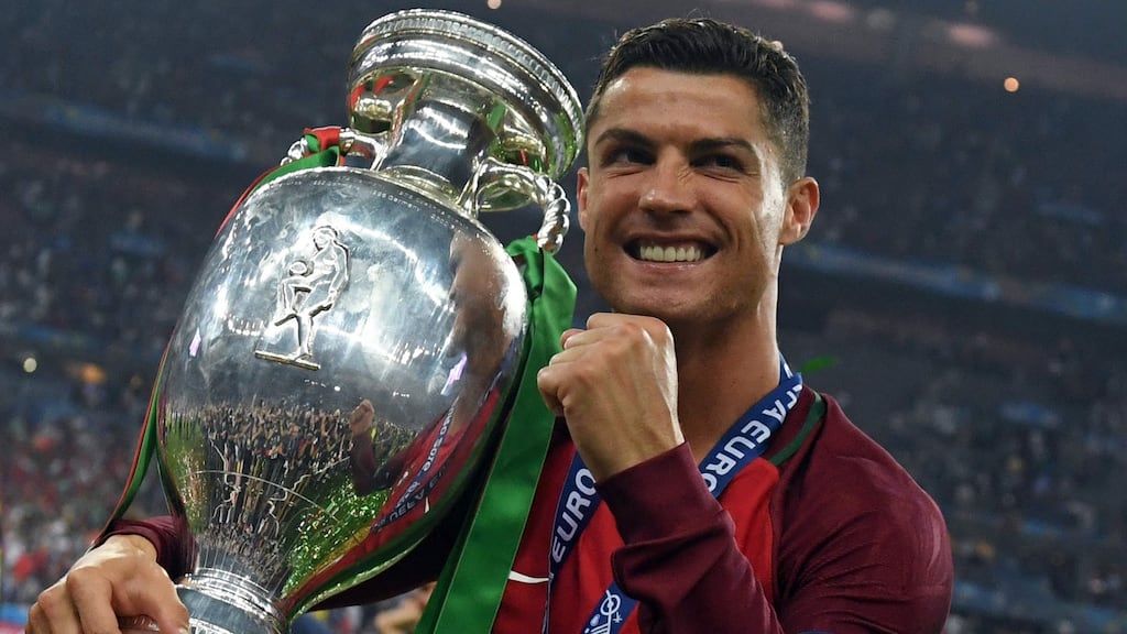 Portugal’s forward Cristiano Ronaldo smiles while posing with the trophy after Portugal won the Euro 2016 final football match between Portugal and France at the Stade de France in Saint-Denis, north of Paris, on July 10th. Photograph: Francisco Leong/AFP/Getty Images