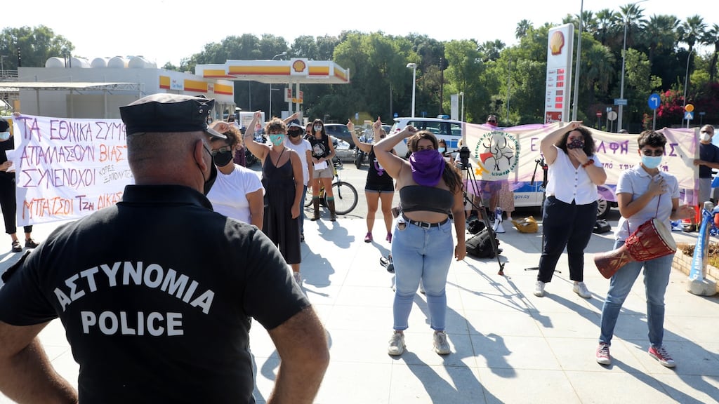 Activists demonstrate outside the supreme court in Cyprus to support a British woman who was convicted of falsely claiming to have been gang raped. Photograph: Katia Christodoulou/EPA