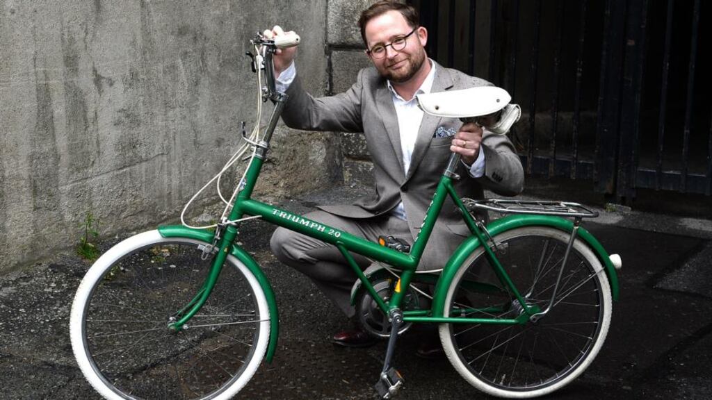 Simon O’Connor of the Little Museum of Dublin with the Triumph 20 he bought at Dublin Flea Market, Newmarket Square. Photograph: Cyril Byrne