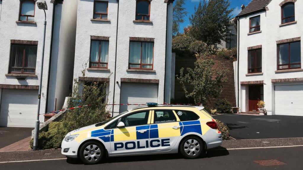 Police at the scene in the Abbey area of Ballycastle, Co Antrim, after an elderly couple were found dead at a property. Photograph: Lesley-Anne McKeown/PA Wire