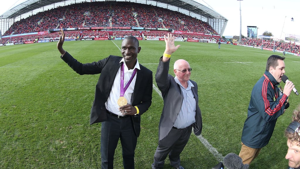 Colm O’Connell with David Rudisha on the Thomond Park pitch in 2012. Photograph: Billy Stickland/Inpho