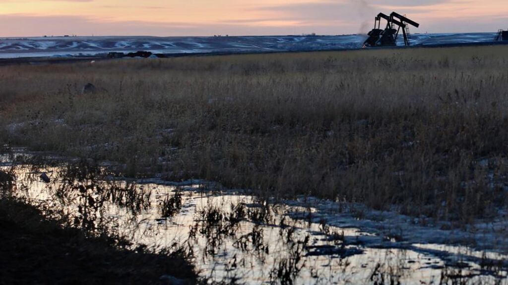 Oil pumpjacks are seen during sunrise in Williston, North Dakota March 14, 2013. REUTERS/Shannon Stapleton