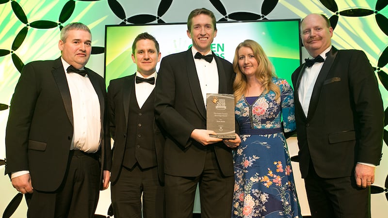 Mary Whinnery, Product Manager, Calor presents The Green Food & Beverage award to the Dawn Meats team.