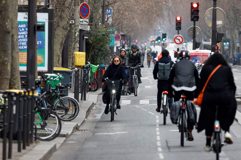 Bike paths have separate traffic lights in Paris, meaning you have to check for a green light for bikes coming from your left, then for cars coming from your right and left, and again for bikes to your right. Photograph: Ludovic Marin/AFP
