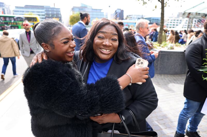 Esther Oyewusi, from Dublin, congratulates her mother Rebecca Ifesanmi, originally from Nigeria. Photograph: Dara Mac Dónaill