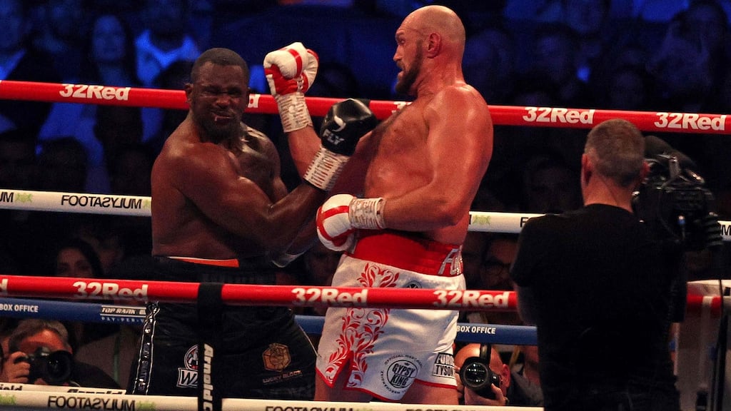 Britain’s Tyson Fury  lands a punch to knock down Britain’s Dillian Whyte in the sixth round  of their WBC heavyweight title fight at Wembley, London, on April 23th, 2022.  Photograph: Adrian Dennis/AFP via Getty Images