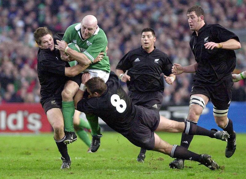 Keith Wood being tackled by All Blacks flanker Richard McCaw and number eight Scott Robertson. In everything he did on the pitch, Wood carried the air of defiance, of a new more ambitious Ireland. Photograph: Eric Luke