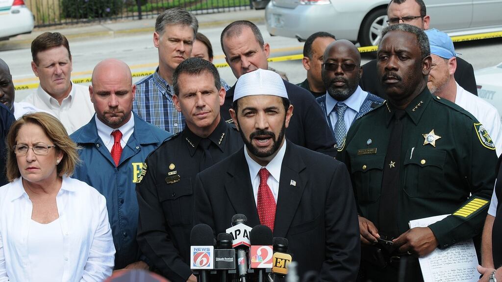 Muhammad Musri, iman of the Islamic Society of Central Florida, with law enforcement and local community leaders at a press conference in Orlando. Photograph: Gerardo Mora/Getty Images