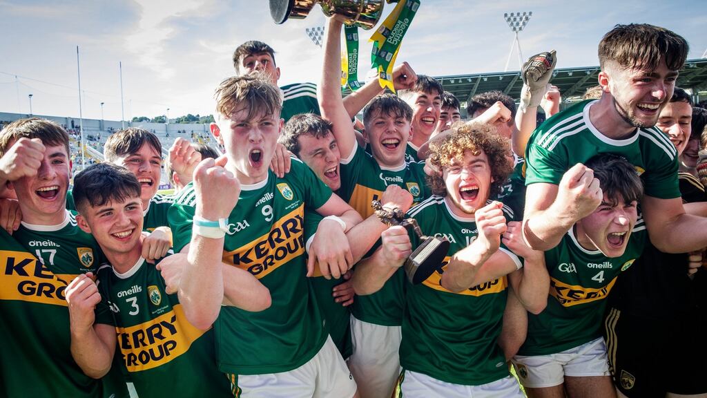 The Kerry team celebrate with the trophy. Photograph: Ryan Byrne/Inpho