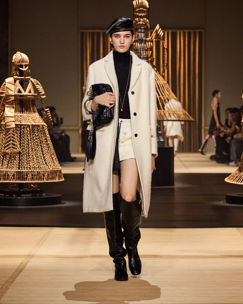 Skirts cut above the knee were a reference to Miss Dior at the Paris Fashion Week show