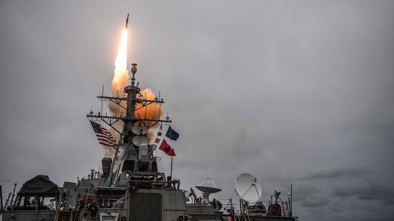 A handout photo file made available by the US Navy on 14 April 2018, shows the Arleigh Burke-class guided-missile destroyer USS Donald Cook (DDG 75) firing a standard missile 3 during an exercise at sea, in the Atlantic Ocean, 15 October 2017. Photograph: EPA