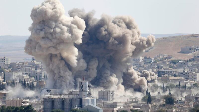 Smoke rises after an US-led air strike in the Syrian town of Kobani today. Photograph: Murad Sezer/Reuters