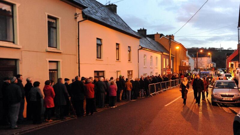 Jackie Healy-Rae’s mourners line the street in Kilgarvan, Co Kerry, on Sunday. Photograph: Don MacMonagle