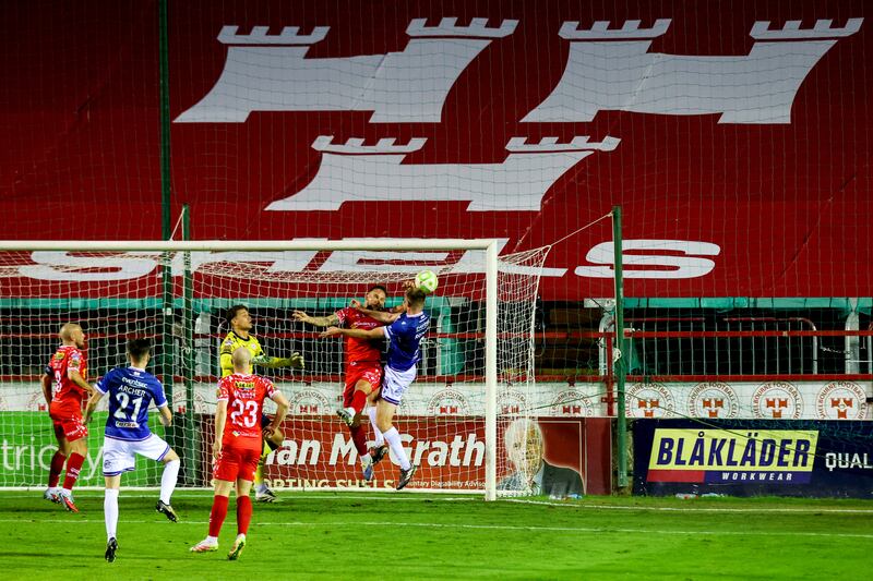 Shelbourne's Paddy Barrett makes a handball on the goal line to concede a penalty to Linfield in last week's first leg play-off. Photograph: Ryan Byrne/Inpho