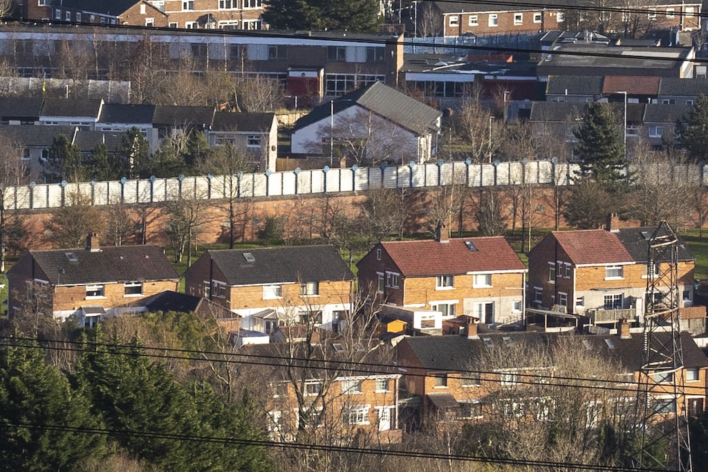 The 5.5m peace wall that separates the mainly nationalist district of Ballymurphy and the mainly unionist Springmartin housing estate in Belfast. Photograph: PA Wire/Liam McBurney