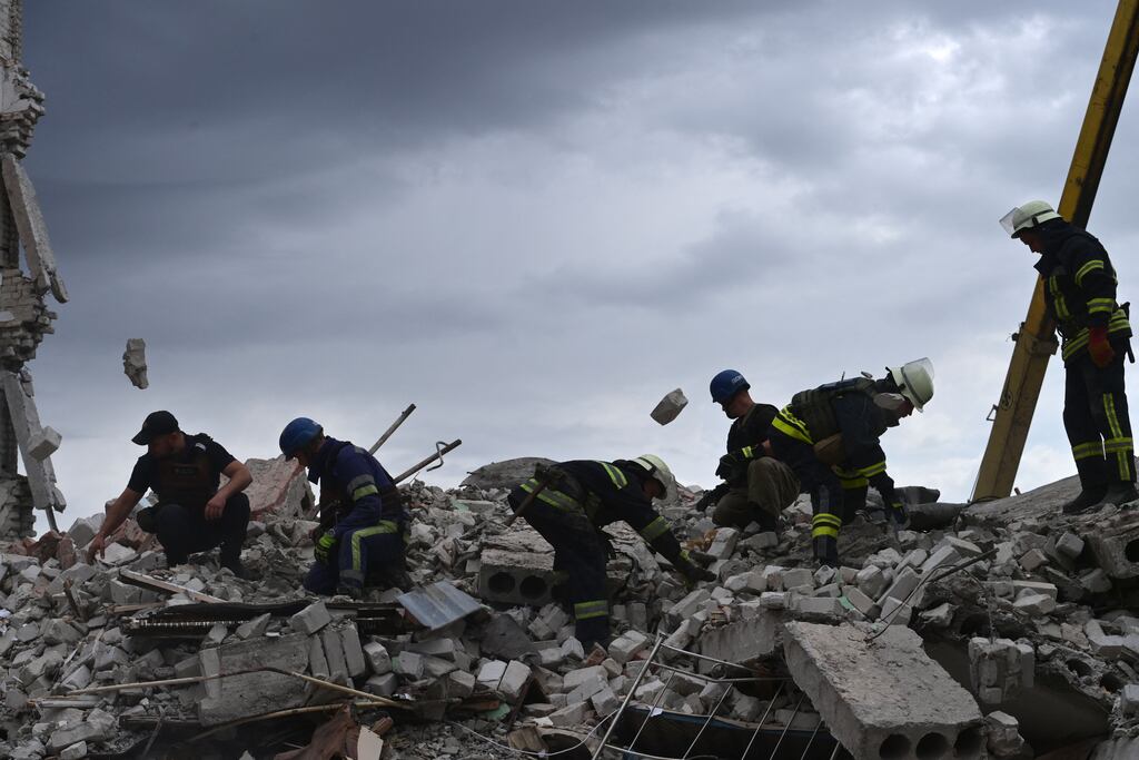 Rescuers clear the scene after a building was partially destroyed as a result of a Russian missile hit on two five-story residential buildings in Chasiv Yar, Bakhmut District, eastern Ukraine. Photograph: MIGUEL MEDINA/AFP