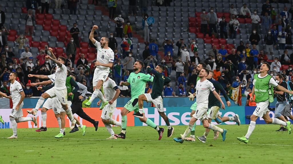 Italy celebrate their 2-1 victory over Belgium in Munich. Photograph: Christof Stache/Getty