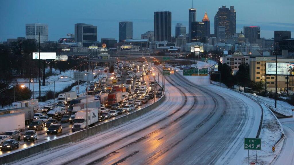 The Atlanta southbound connector is clogged with traffic as the connector northbound is an empty sheet of ice due to a snow storm in Atlanta, Georgia. Photograph: Ben Gray/Atlanta Journal/Reuters