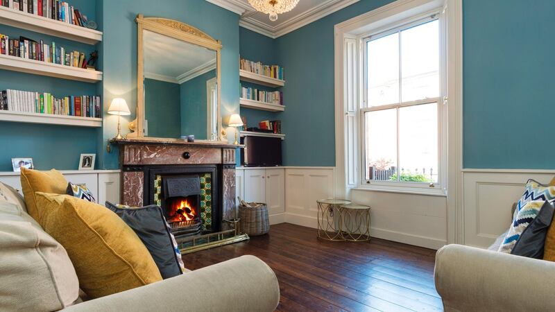 The drawing room at 3 Oxford Road has new wainscoting and a period fireplace