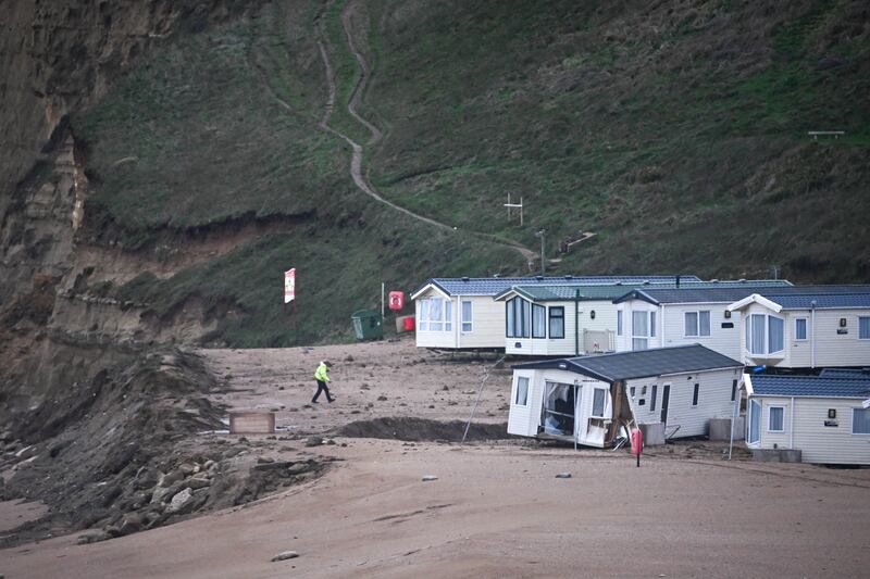 Damaged holiday chalet on the beach at Freshwater Beach Holiday Park, in Dorset UK. Photograph: Finnbarr Webster/Getty Images
